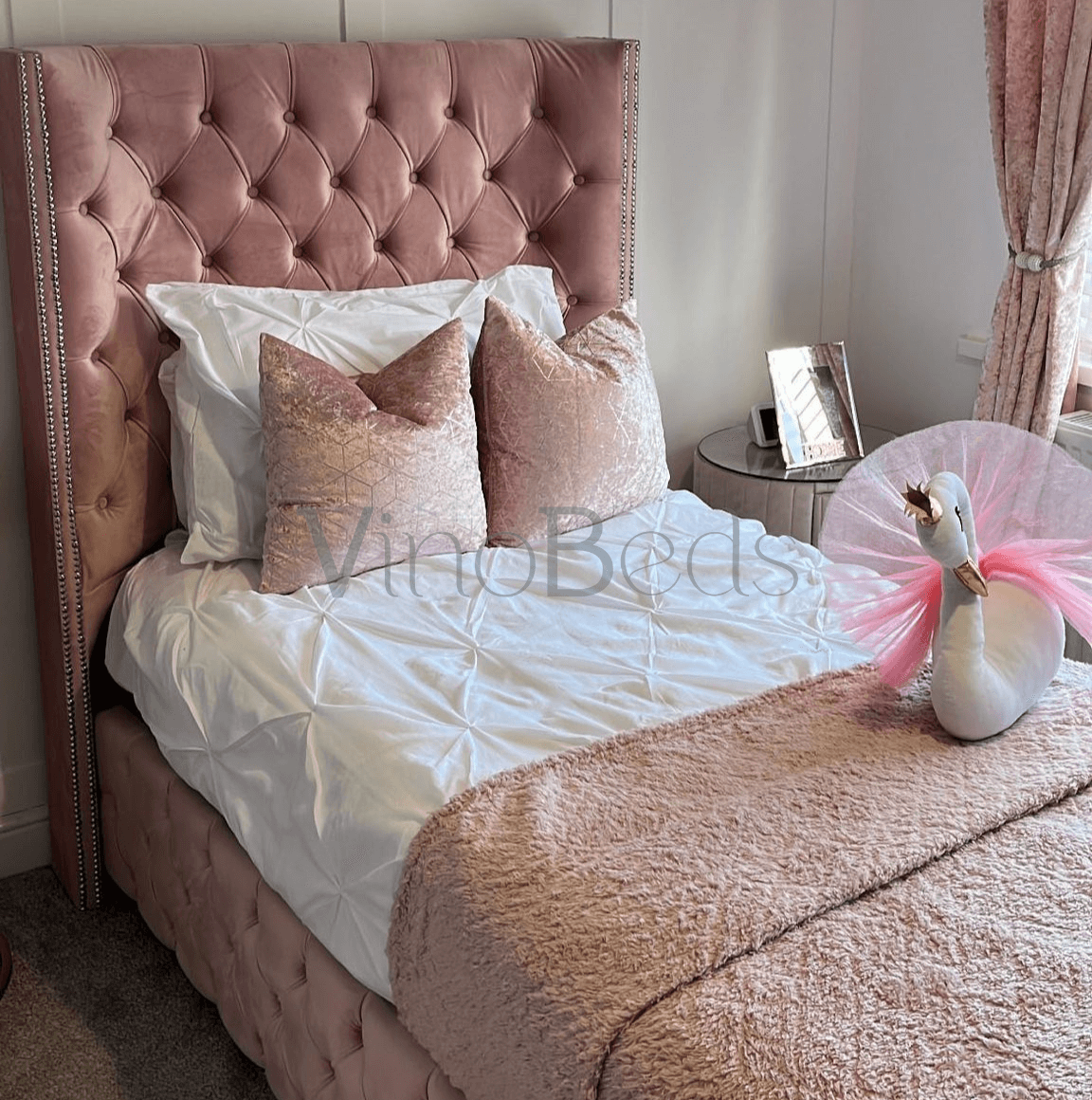 Side view of Burby Bed in a decorated kids' bedroom, featuring soft fabric and playful princess-style design
